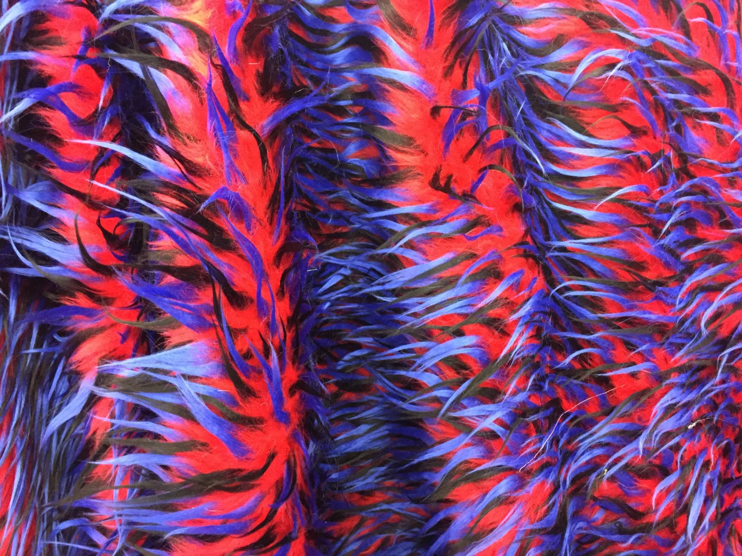 3 tone spikes faux fur- red/royal blue/black. Shaggy faux fur sold by the yard.