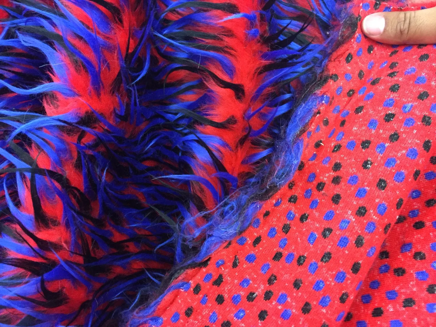 3 tone spikes faux fur- red/royal blue/black. Shaggy faux fur sold by the yard.