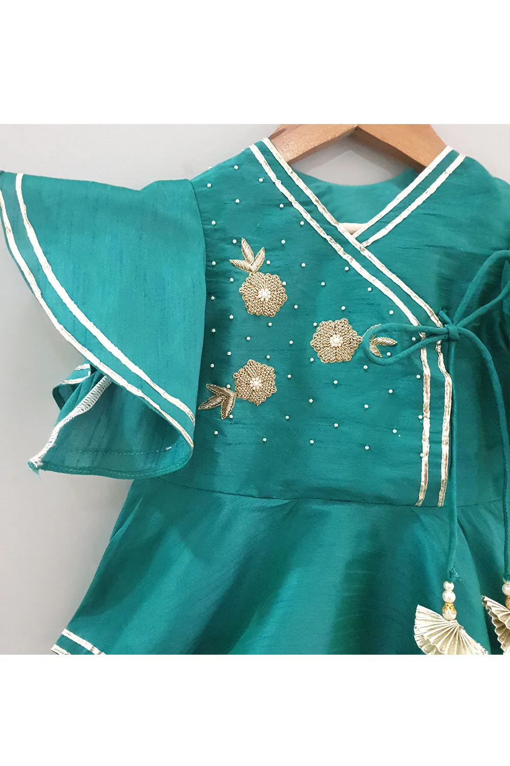 Bottle green embroidered angrakha peplum top with dhoti pants