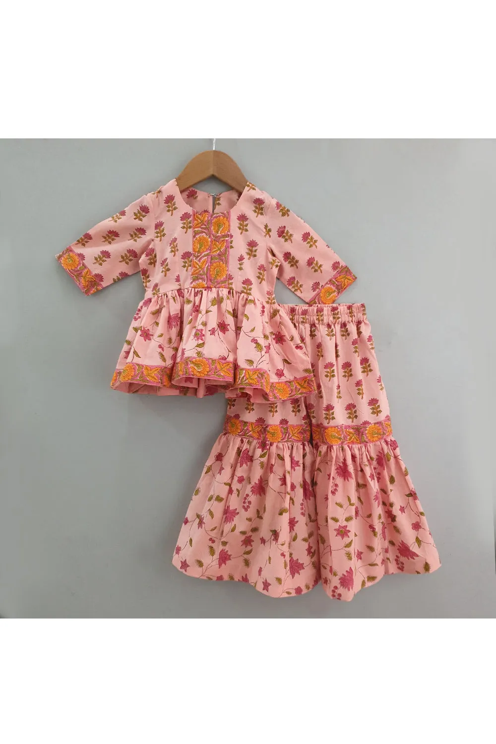 Peach hand block printed peplum style top with sharara set